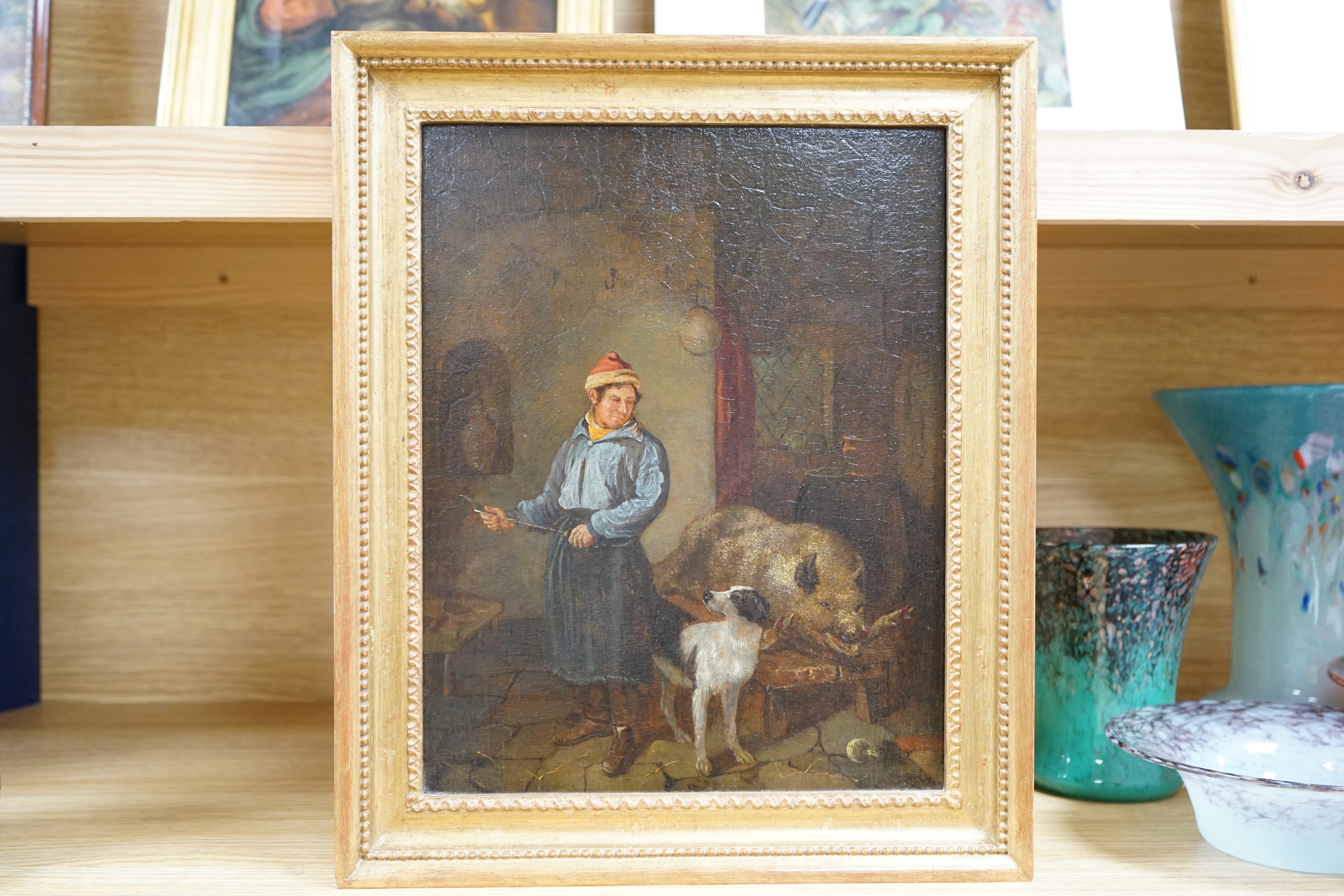 After George Morland (1763-1804), oil on oak panel, Interior with a figure preparing to butcher a pig, unsigned, 31 x 25cm